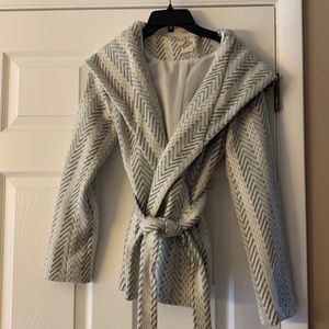 Super cute jacket.  Only worn a couple of times.  Smoke free house.  Belt tie.